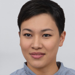 Joyful asian young-adult female with short  black hair and brown eyes