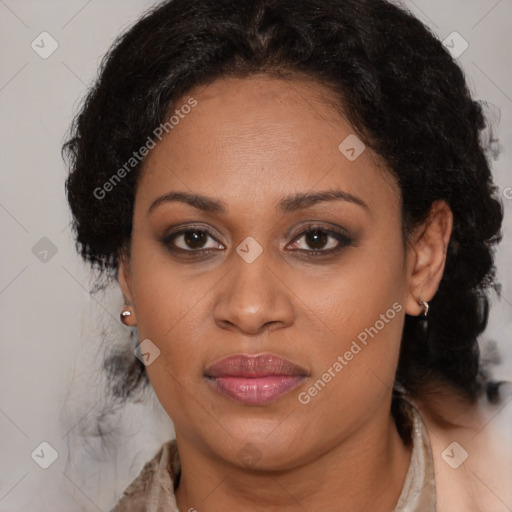 Joyful black adult female with medium  brown hair and brown eyes