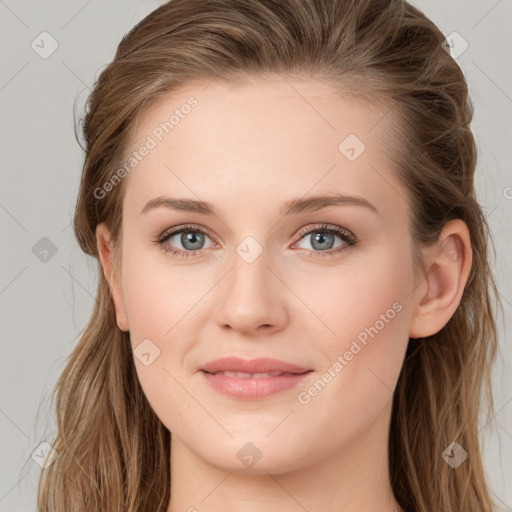 Joyful white young-adult female with long  brown hair and blue eyes