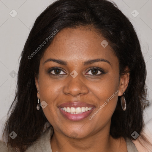 Joyful black young-adult female with long  brown hair and brown eyes