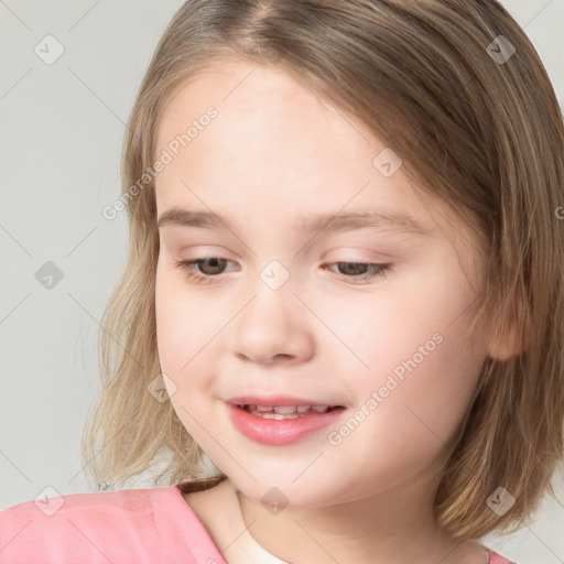 Joyful white child female with medium  brown hair and brown eyes