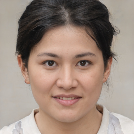 Joyful white young-adult female with medium  brown hair and brown eyes
