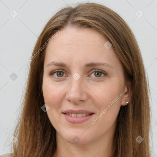 Joyful white adult female with long  brown hair and brown eyes