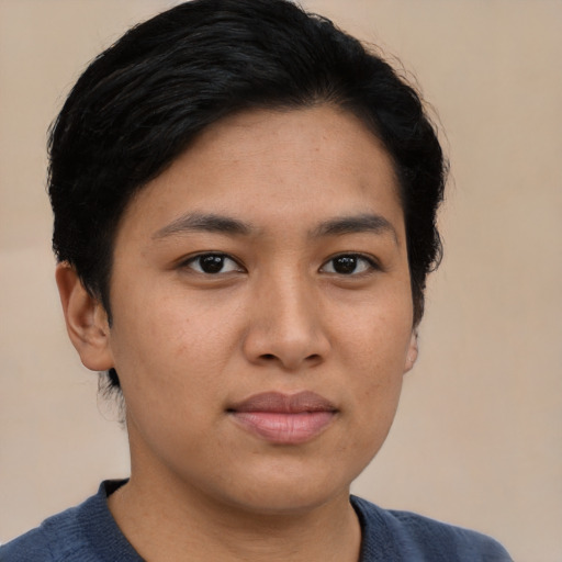 Joyful asian young-adult female with short  black hair and brown eyes