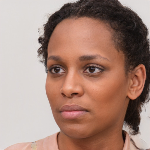 Neutral black young-adult female with short  brown hair and brown eyes