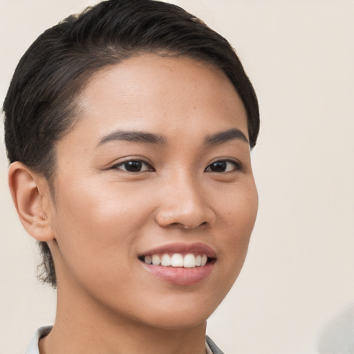 Joyful white young-adult female with short  brown hair and brown eyes