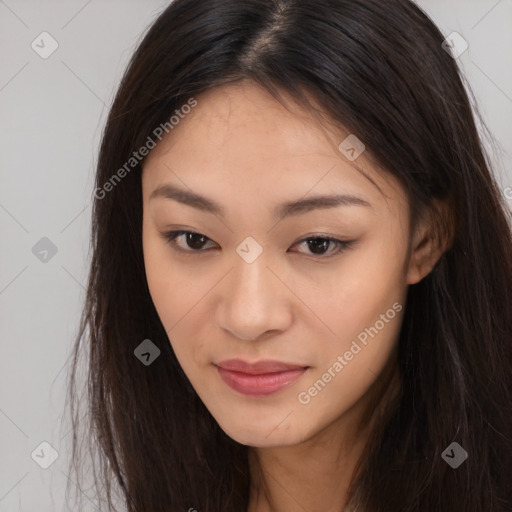 Joyful asian young-adult female with long  brown hair and brown eyes