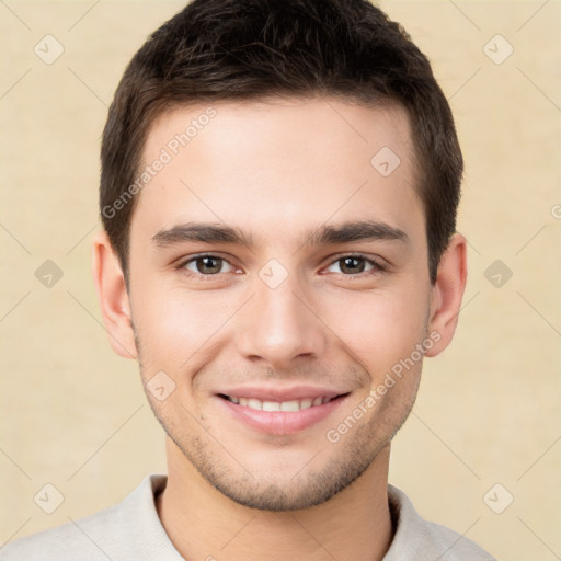 Joyful white young-adult male with short  brown hair and brown eyes