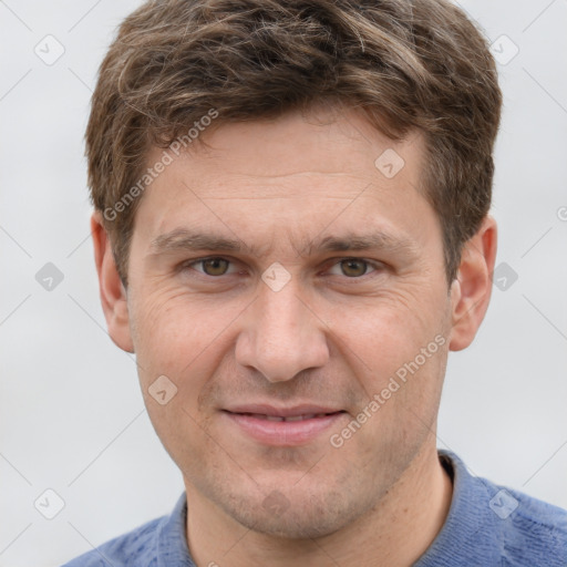 Joyful white adult male with short  brown hair and grey eyes