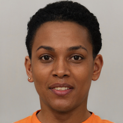 Joyful black young-adult female with short  black hair and brown eyes
