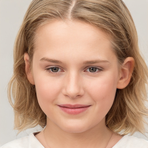 Joyful white child female with medium  brown hair and brown eyes