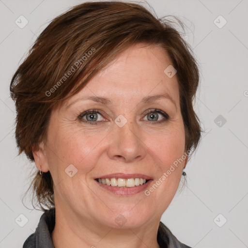 Joyful white adult female with medium  brown hair and grey eyes