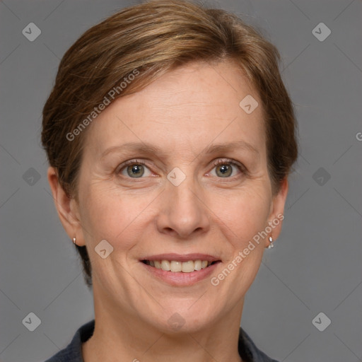 Joyful white adult female with medium  brown hair and grey eyes