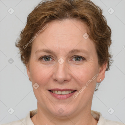 Joyful white adult female with short  brown hair and grey eyes