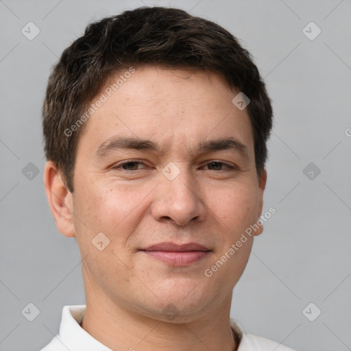 Joyful white adult male with short  brown hair and brown eyes