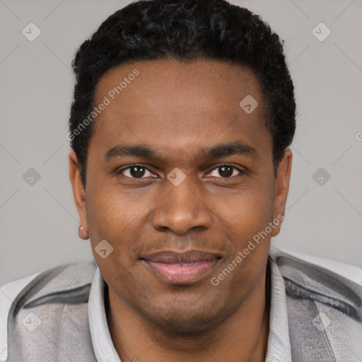 Joyful black young-adult male with short  black hair and brown eyes