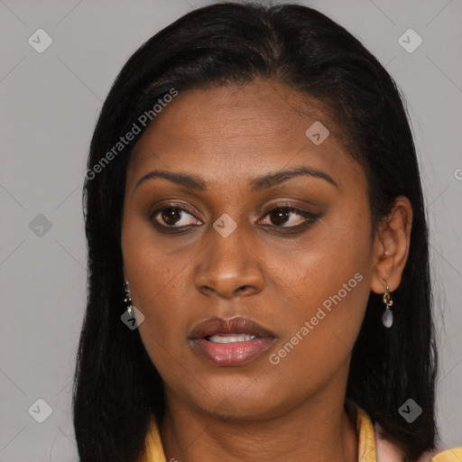 Joyful black young-adult female with long  brown hair and brown eyes