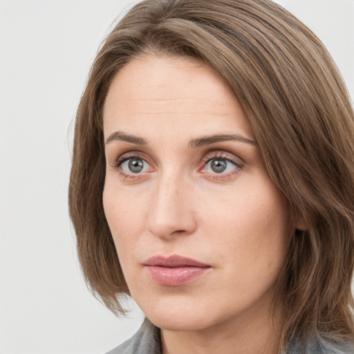 Neutral white young-adult female with medium  brown hair and grey eyes