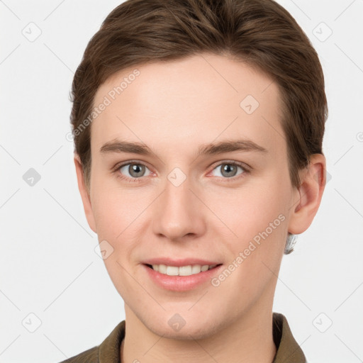 Joyful white young-adult female with short  brown hair and grey eyes