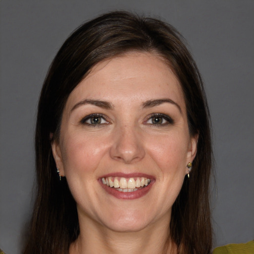 Joyful white young-adult female with medium  brown hair and brown eyes