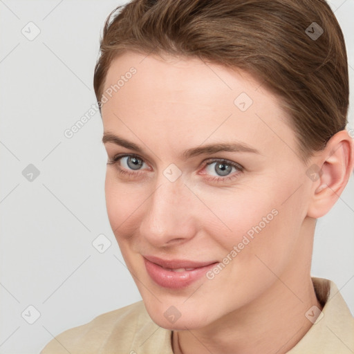 Joyful white young-adult female with short  brown hair and grey eyes