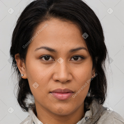 Joyful latino young-adult female with medium  brown hair and brown eyes