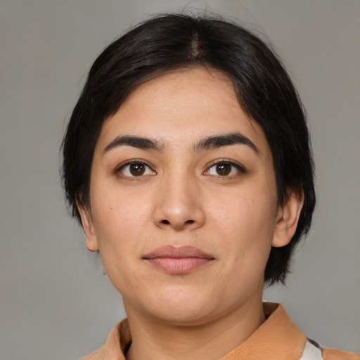 Joyful latino young-adult female with medium  brown hair and brown eyes
