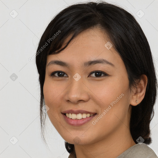 Joyful asian young-adult female with medium  black hair and brown eyes