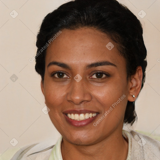 Joyful latino young-adult female with short  brown hair and brown eyes