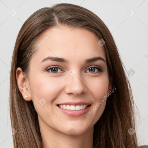 Joyful white young-adult female with long  brown hair and grey eyes