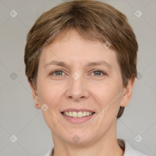 Joyful white adult female with short  brown hair and grey eyes