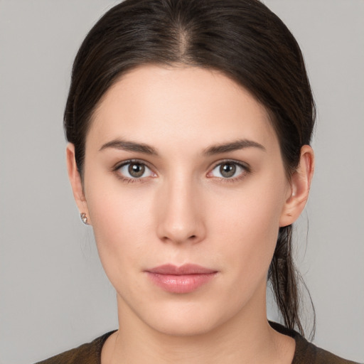 Neutral white young-adult female with medium  brown hair and brown eyes