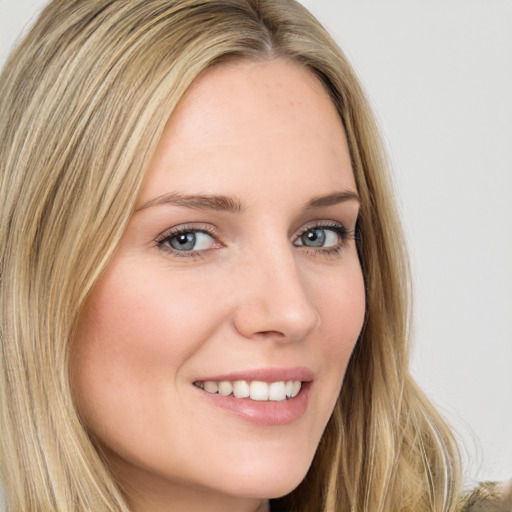 Joyful white young-adult female with long  brown hair and green eyes