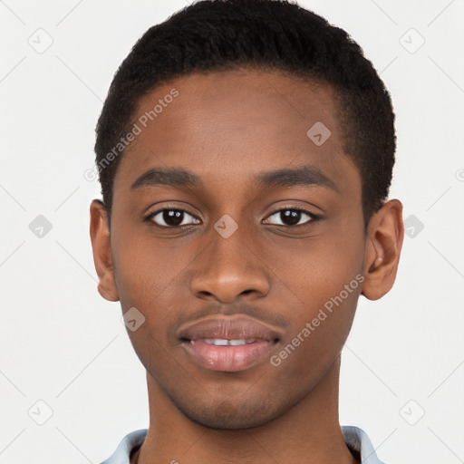 Joyful black young-adult male with short  brown hair and brown eyes