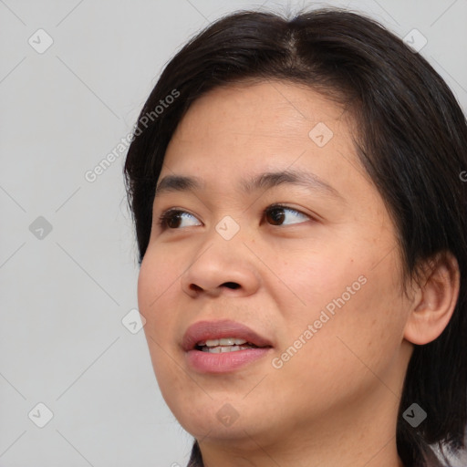 Joyful asian young-adult female with medium  brown hair and brown eyes