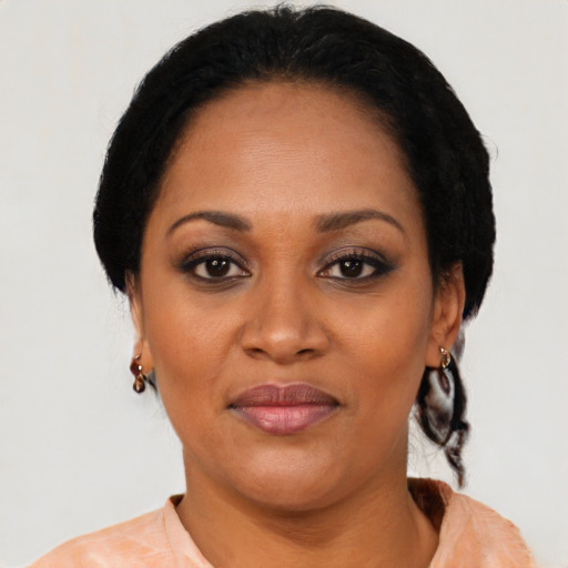 Joyful black young-adult female with medium  brown hair and brown eyes