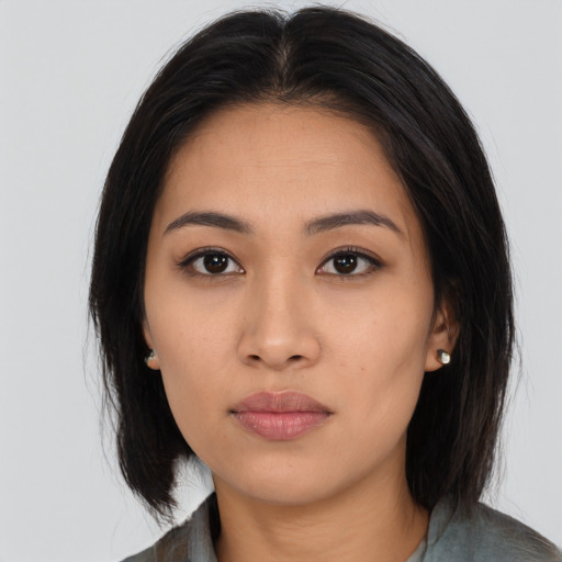 Neutral asian young-adult female with long  brown hair and brown eyes