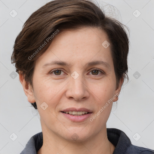 Joyful white adult female with short  brown hair and grey eyes