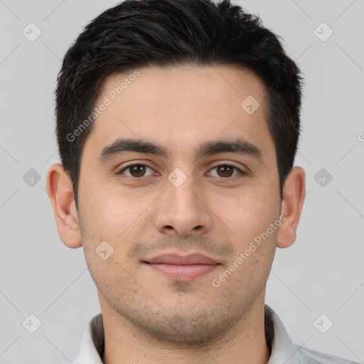 Joyful white young-adult male with short  black hair and brown eyes