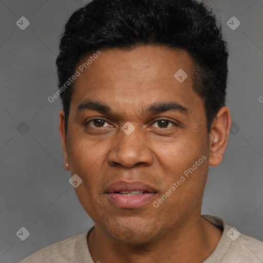 Joyful black adult male with short  black hair and brown eyes