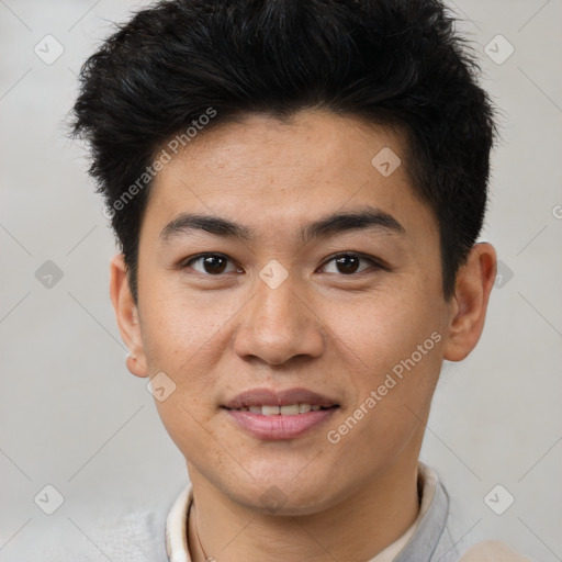 Joyful asian young-adult male with short  brown hair and brown eyes