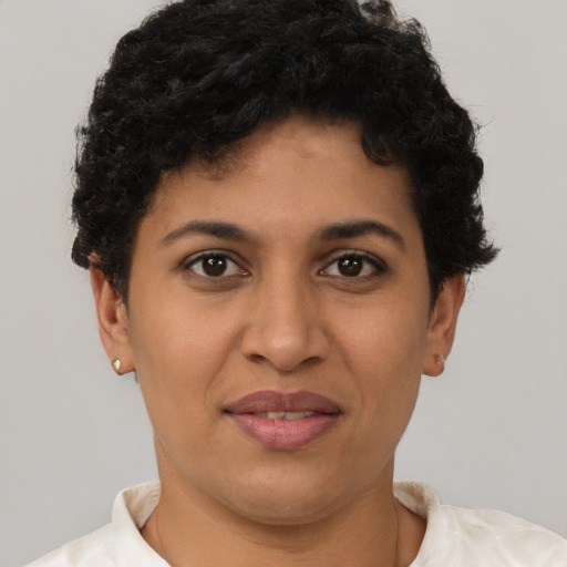 Joyful latino young-adult female with short  brown hair and brown eyes