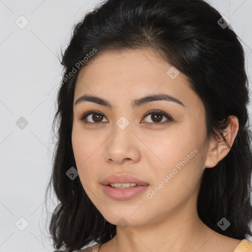 Joyful asian young-adult female with long  brown hair and brown eyes