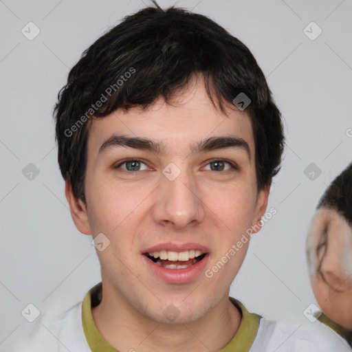 Joyful white young-adult male with short  black hair and brown eyes