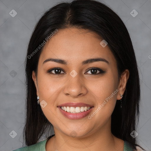 Joyful latino young-adult female with medium  brown hair and brown eyes