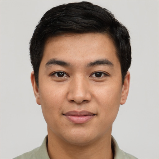 Joyful asian young-adult male with short  black hair and brown eyes