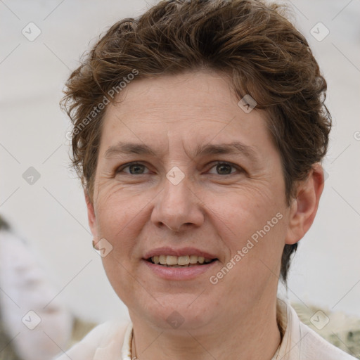 Joyful white adult female with short  brown hair and grey eyes