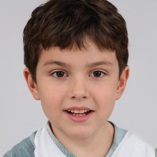 Joyful white child male with short  brown hair and brown eyes