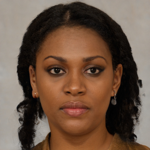 Neutral black young-adult female with medium  black hair and brown eyes