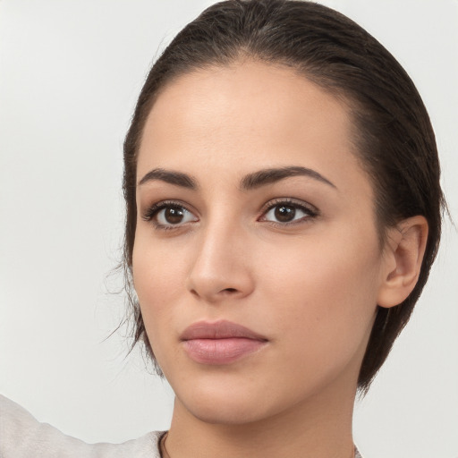 Neutral white young-adult female with medium  brown hair and brown eyes